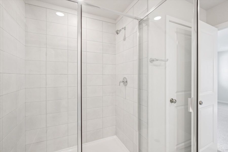 A shower with a glass door. A shower with a glass door.