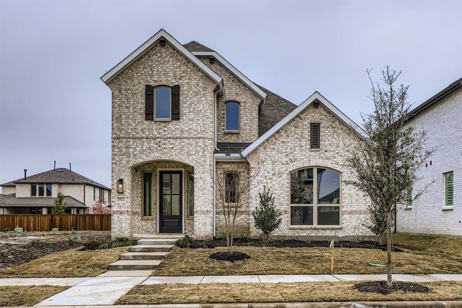 Front exterior of a new home in Mosaic 40s, Celina, TX, highlighting curb appeal (Image 2).