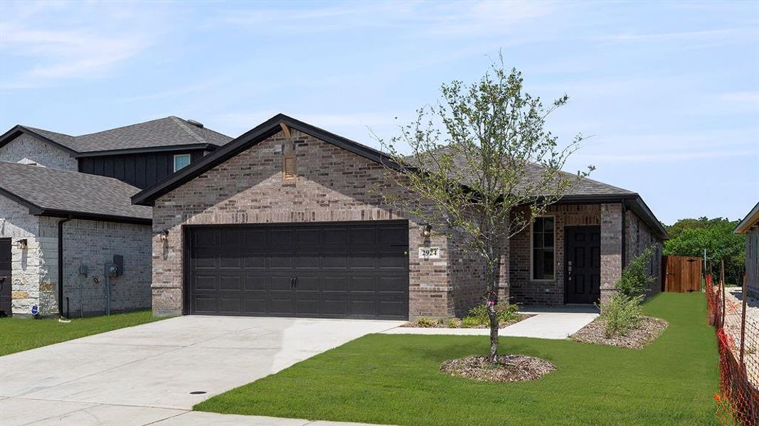 Front exterior of a new home in Churchill 40s, Anna, TX, highlighting curb appeal (Image 16).