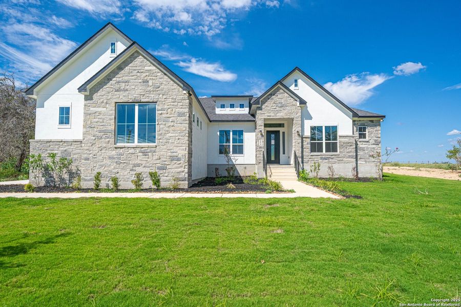 Front exterior of a new home in , Floresville, TX, highlighting curb appeal (Image 1). Front exterior of a new home in , Floresville, TX, highlighting curb appeal (Image 1).