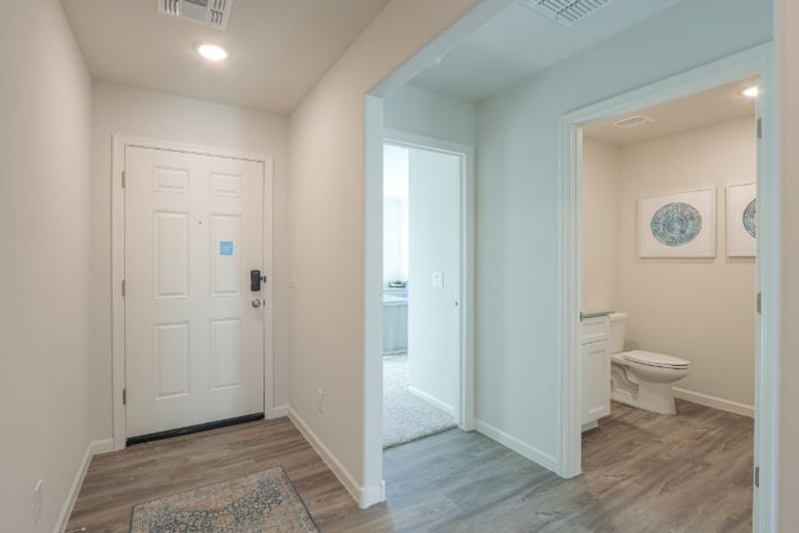 A bathroom with white doors.