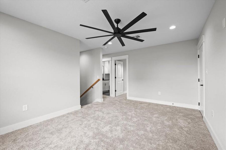 Carpeted spare room featuring recessed lighting and ceiling fan