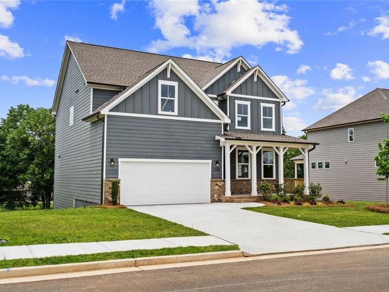 Front exterior of a new home in Wehunt Meadows, Hoschton, GA, highlighting curb appeal (Image 22).