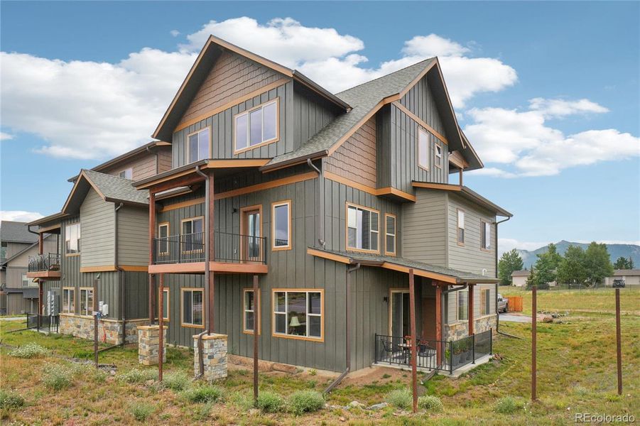 Front exterior of a new home in , Estes Park, CO, highlighting curb appeal (Image 21).