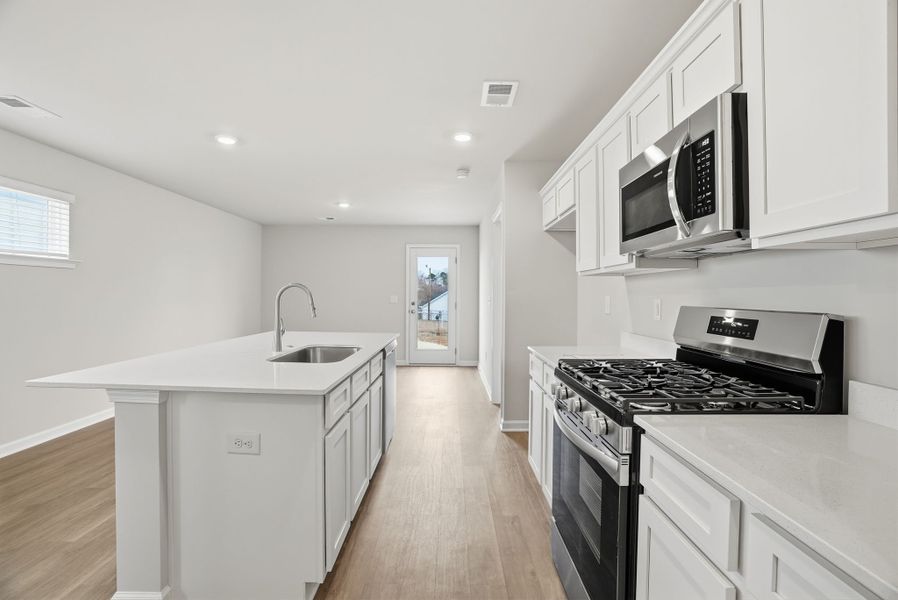 Representative furnished interior of a home built from the Juniper A by McGuinn Homes in Forts Ridge, Pelion (Image 7).