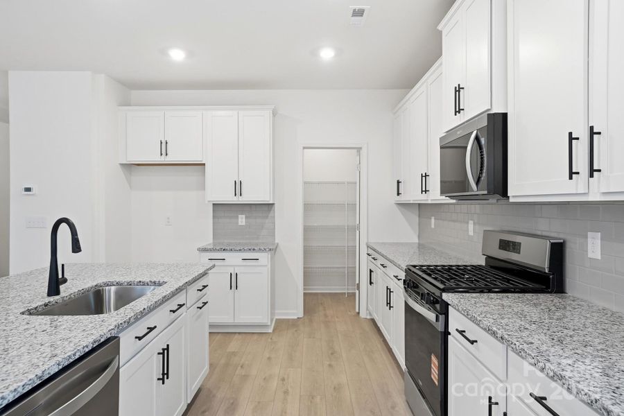 Furnished interior view inside a new home in Wellington Pointe Executive, Monroe (Image 10).