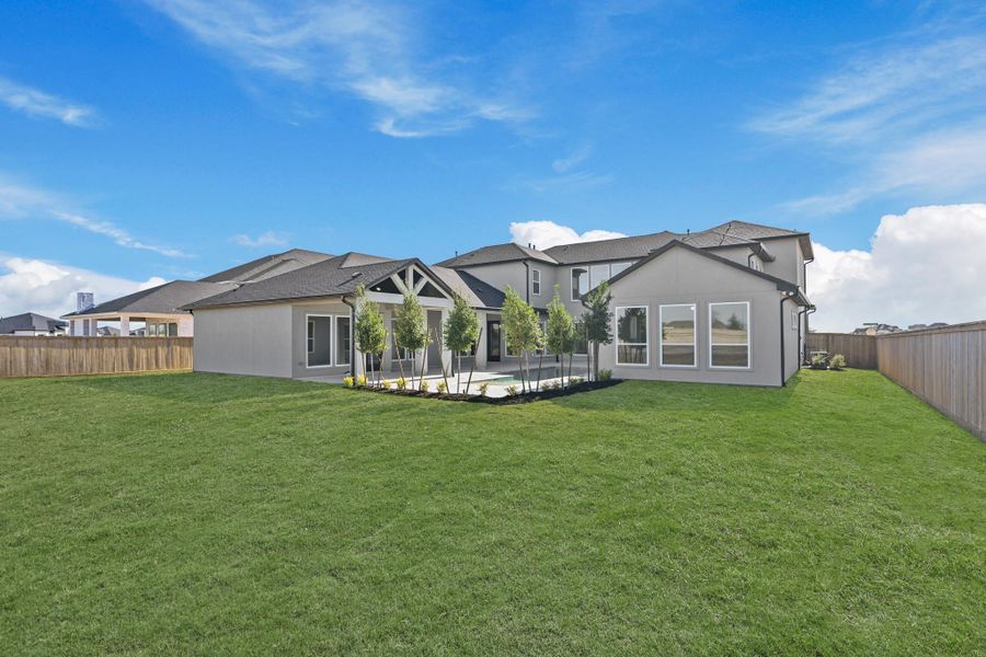 Exterior details and patio area of a home in Bridgeland, Cypress (Image 26).