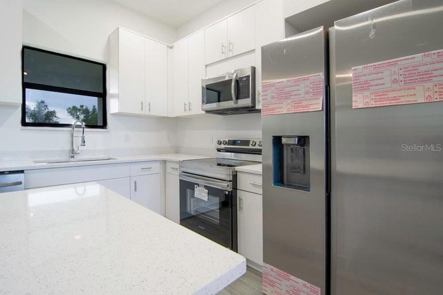 Furnished interior view inside a new home in , Port Charlotte (Image 6).