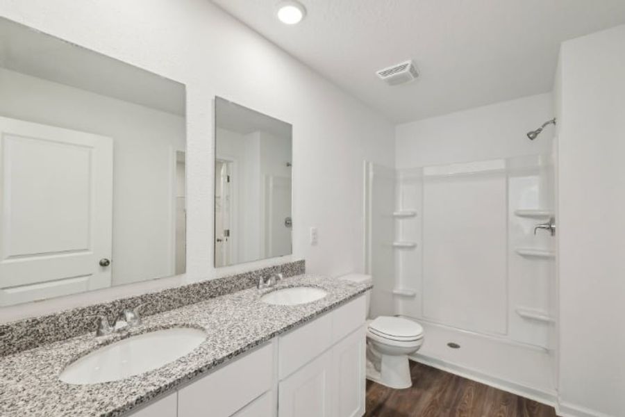 A bathroom with a marble countertop.
