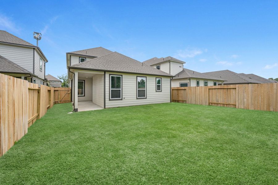 Exterior details and patio area of a home in Cypresswood Landing, Humble (Image 4).