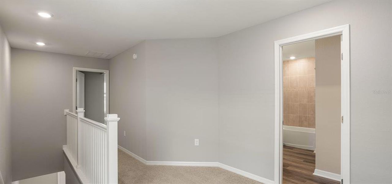 Spacious, unfurnished interior of a new home in Estates at Hickory Cove - Bungalows, St. Cloud (Image 14).