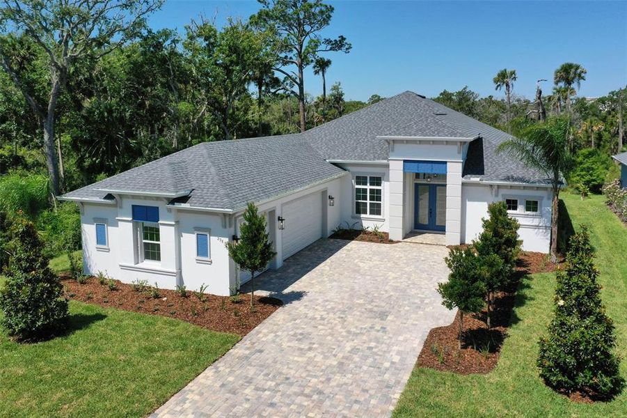 Front exterior of a new home in , Palm Coast, FL, highlighting curb appeal (Image 28). Front exterior of a new home in , Palm Coast, FL, highlighting curb appeal (Image 28).