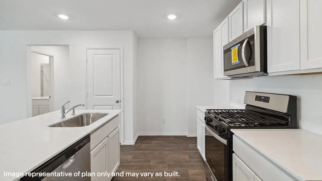 Gleaming counters and modern appliances adorn this well-appointed kitchen, ready for culinary endeavors. Gleaming counters and modern appliances adorn this well-appointed kitchen, ready for culinary endeavors.