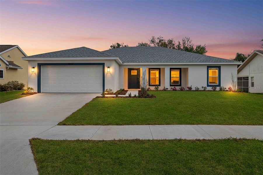 Front exterior of a new home in , Spring Hill, FL, highlighting curb appeal (Image 20). Front exterior of a new home in , Spring Hill, FL, highlighting curb appeal (Image 20).