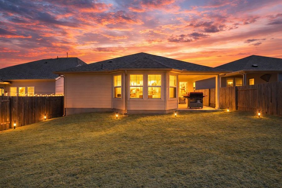 Enjoy cozy evenings entertaining in your backyard.