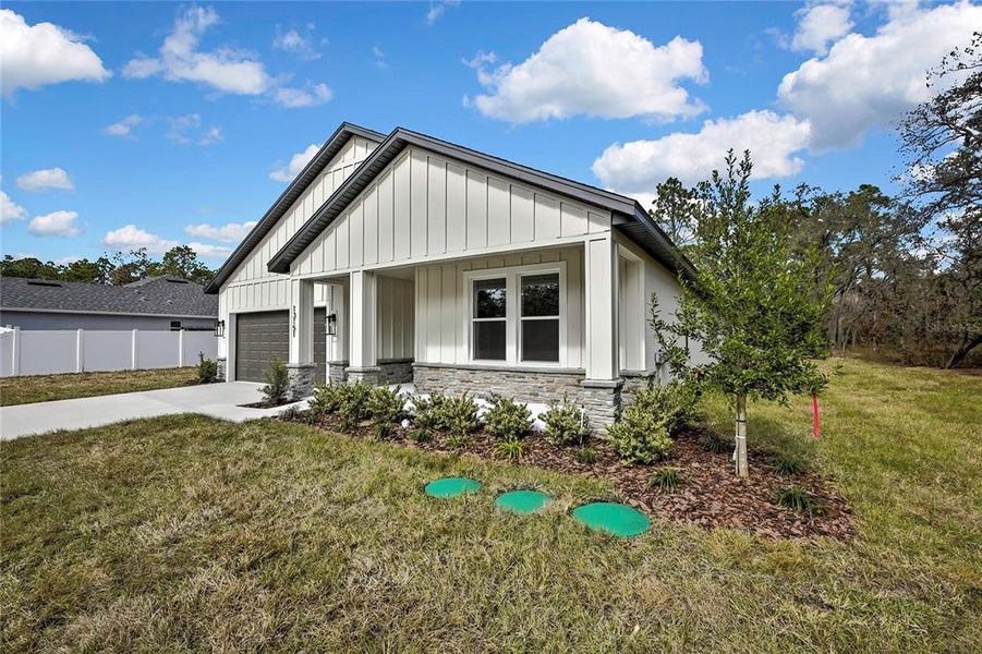 Front exterior of a new home in , Weeki Wachee, FL, highlighting curb appeal (Image 25).