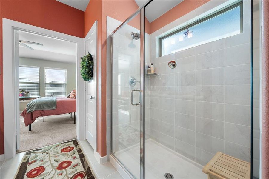 Bathroom with ensuite bath, a shower stall, and tile patterned floors Bathroom with ensuite bath, a shower stall, and tile patterned floors