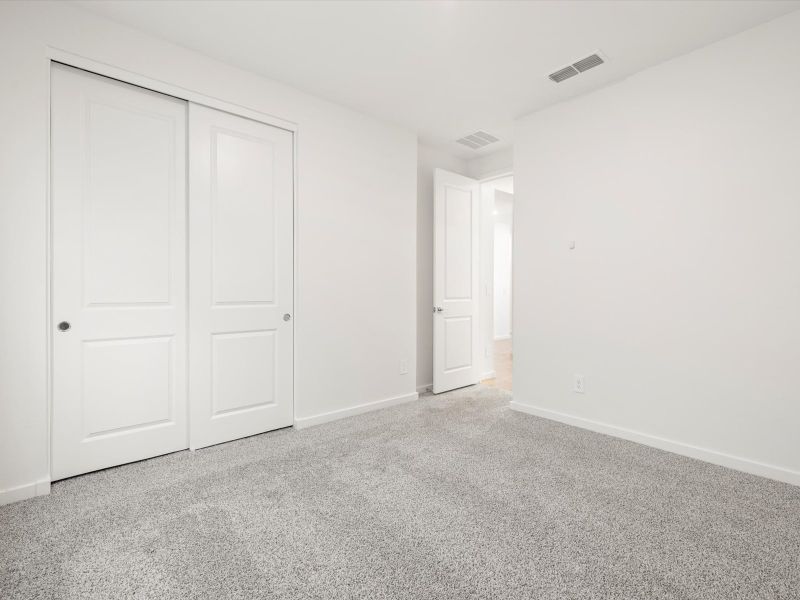 Spacious, unfurnished interior of a new home in Blossom Rock Reserve Series, Apache Junction (Image 12).