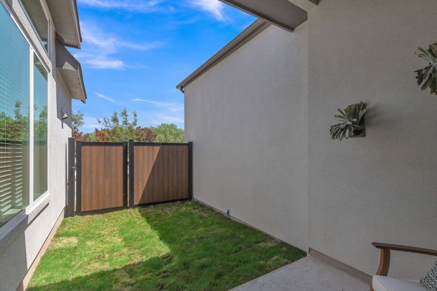 Exterior details and patio area of a home in VIDA Townhomes, San Antonio (Image 3). Exterior details and patio area of a home in VIDA Townhomes, San Antonio (Image 3).