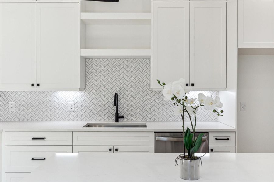 Upgraded ceiling-height shaker style cabinets offer both elegance and space for that timeless charm. Upgraded ceiling-height shaker style cabinets offer both elegance and space for that timeless charm.