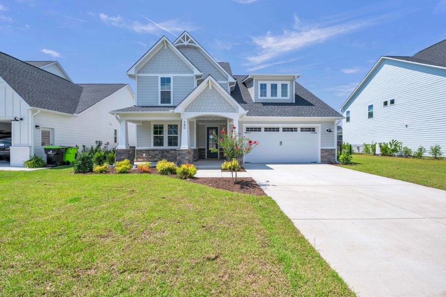 Representative exterior photo of a completed home built from the The Whitley by RobuckHomes in Windwater, Hampstead, NC (Image 37).