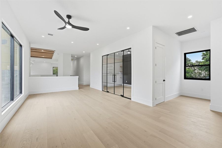 Modified design -Framed by designer glass doors, this versatile bonus space is perfectly suited for a second office, media room, creative studio, or private content room.