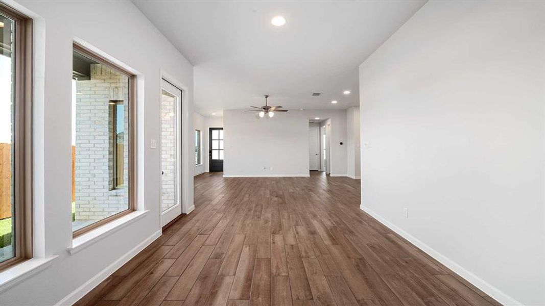 Corridor featuring wood-type flooring