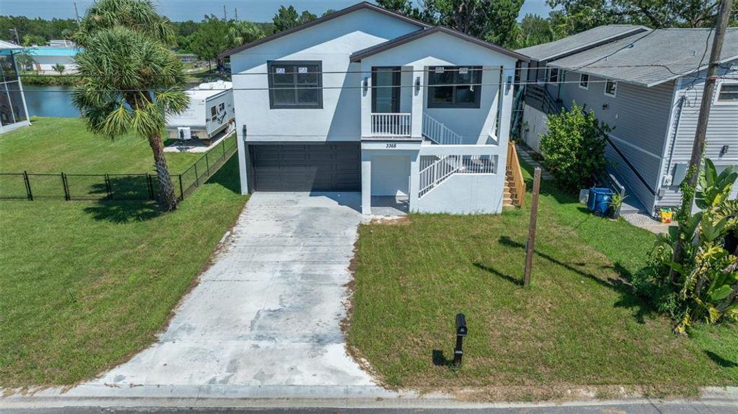 Front exterior of a new home in , Hernando Beach, FL, highlighting curb appeal (Image 1).
