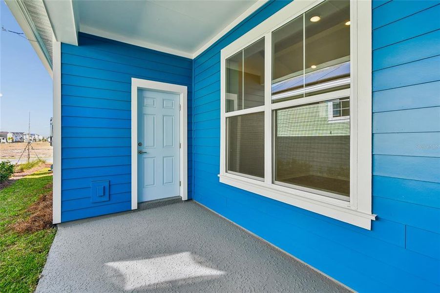 Exterior details and patio area of a home in Laureate Park at Lake Nona - Garden Series, Orlando (Image 3).