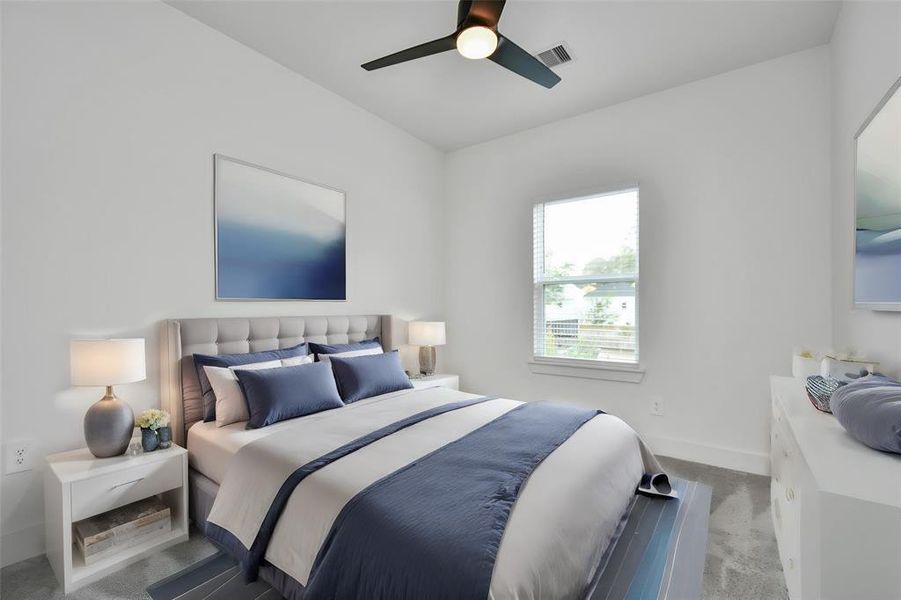 Unwind in the comfort of this inviting second of 2 guest bedrooms, featuring elegant ceiling fan, walk in closet, plus carpeted floor and abundant natural light