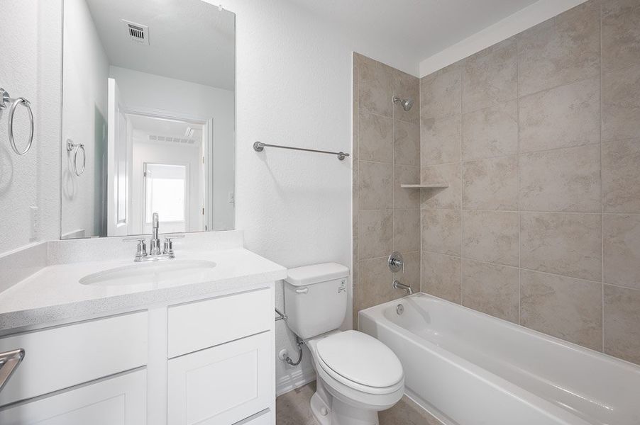 Representative furnished interior of a home built from the Sparrow by Taylor Morrison in Turner's Crossing 50s, Austin (Image 15).