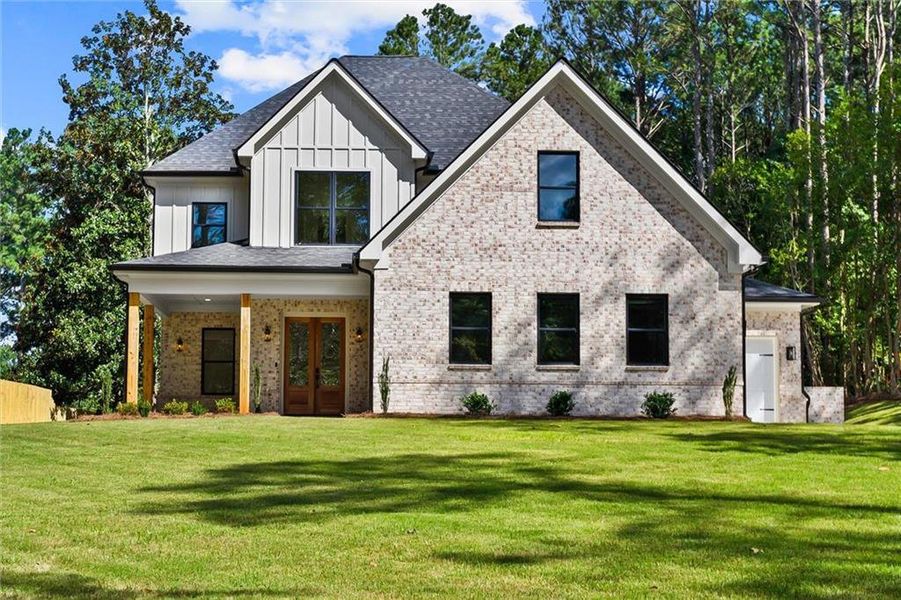 Front exterior of a new home in , Winder, GA, highlighting curb appeal (Image 32). Front exterior of a new home in , Winder, GA, highlighting curb appeal (Image 32).