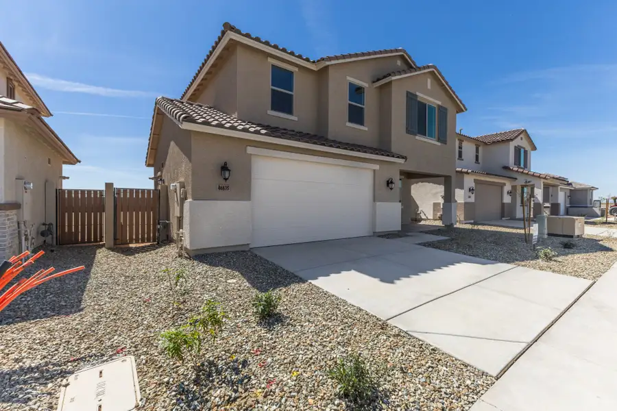 Front exterior of a new home in Elara at Moonlight, Maricopa, AZ, highlighting curb appeal (Image 2). Front exterior of a new home in Elara at Moonlight, Maricopa, AZ, highlighting curb appeal (Image 2).