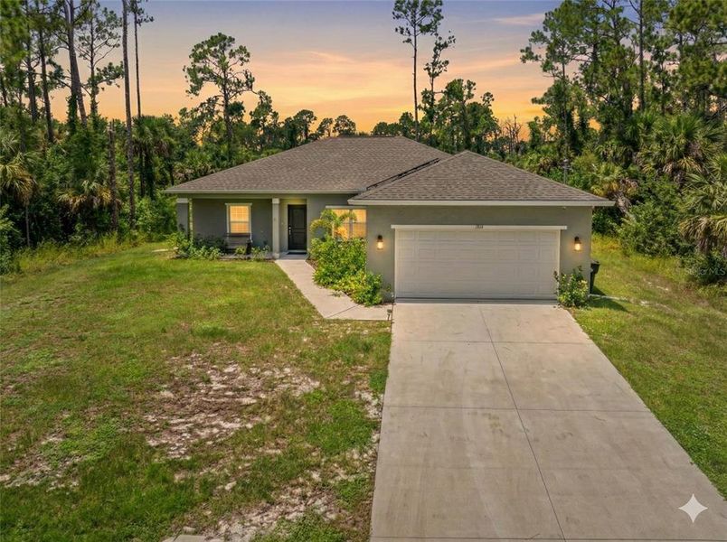 Front exterior of a new home in , North Port, FL, highlighting curb appeal (Image 23).