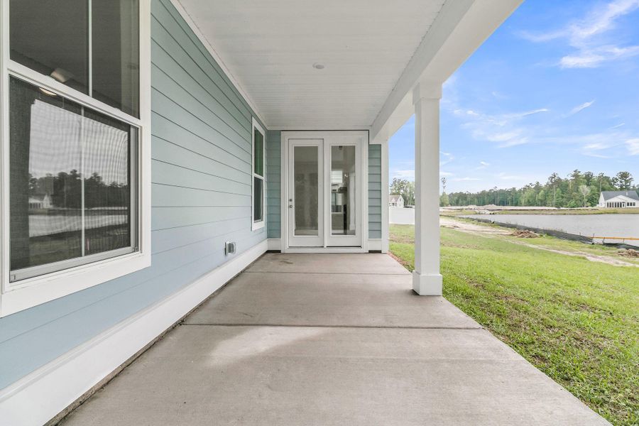 Exterior details and patio area of a home in Tidewater at Lakes of Cane Bay, Summerville (Image 21). Exterior details and patio area of a home in Tidewater at Lakes of Cane Bay, Summerville (Image 21).