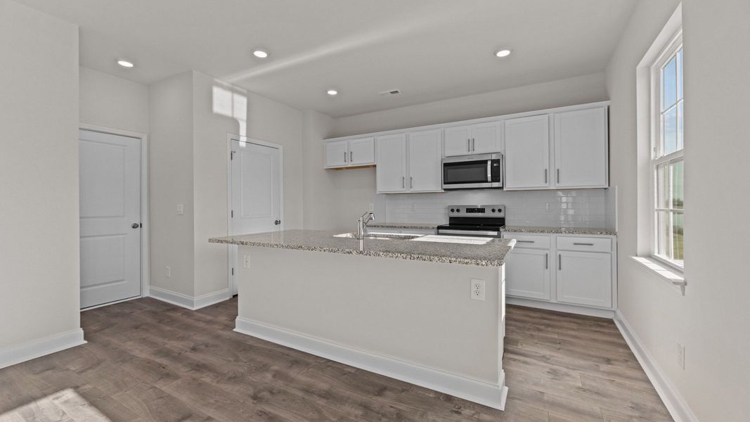 Representative furnished interior of a home built from the Belhaven by D.R. Horton in Tyler - Home on the Lake, New Bern (Image 4). Representative furnished interior of a home built from the Belhaven by D.R. Horton in Tyler - Home on the Lake, New Bern (Image 4).