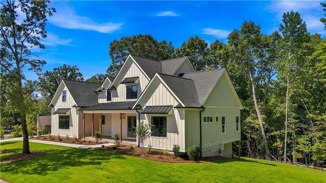 Front exterior of a new home in , Flowery Branch, GA, highlighting curb appeal (Image 25). Front exterior of a new home in , Flowery Branch, GA, highlighting curb appeal (Image 25).