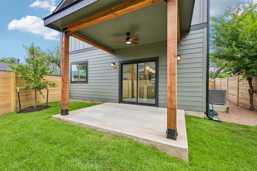 A well-maintained lawn and a private cedar wooden fence.