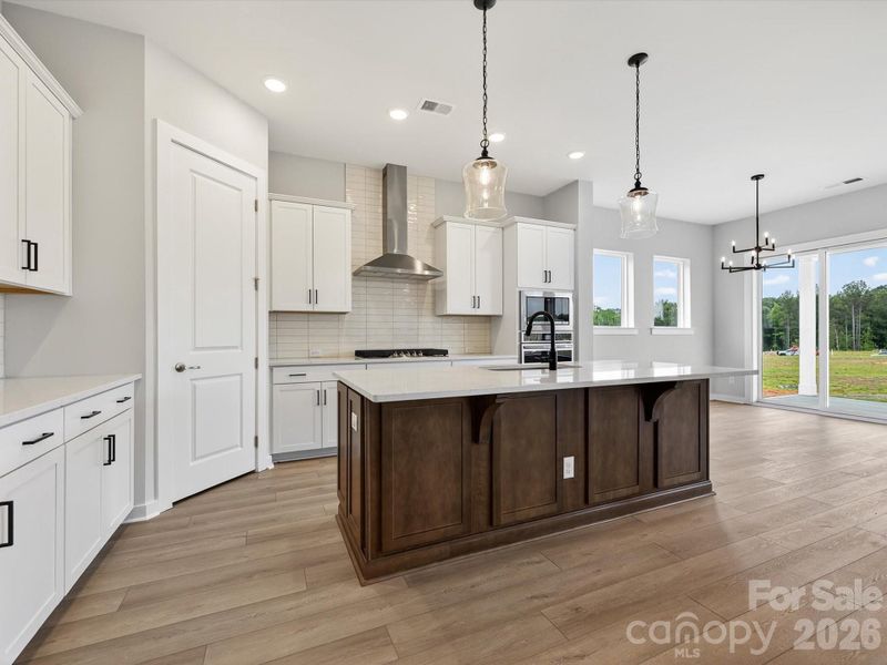 Lovely kitchen with eat at island, and so much light!
