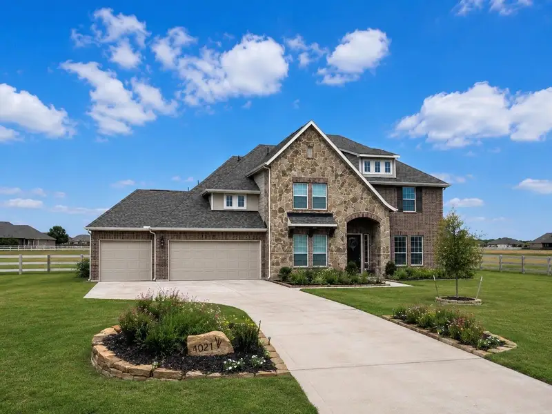 Front exterior of a new home in Lakeview, Waller, TX, highlighting curb appeal (Image 1). Front exterior of a new home in Lakeview, Waller, TX, highlighting curb appeal (Image 1).