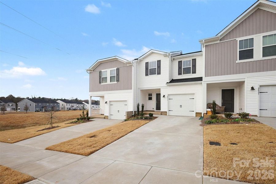 Front exterior of a new home in , Concord, NC, highlighting curb appeal (Image 2). Front exterior of a new home in , Concord, NC, highlighting curb appeal (Image 2).