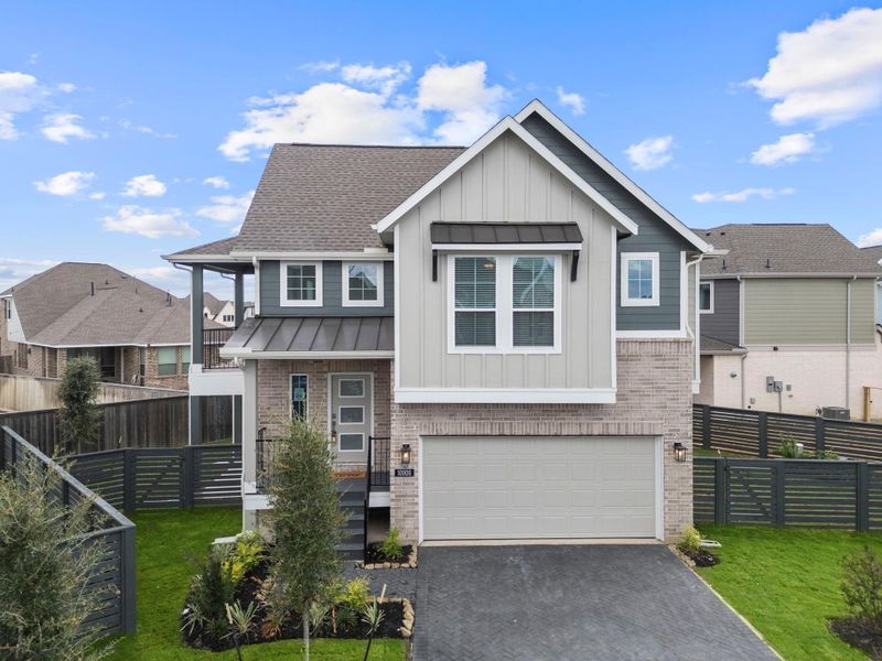 Front exterior of a new home in Bridgeland, Cypress, TX, highlighting curb appeal (Image 1). Front exterior of a new home in Bridgeland, Cypress, TX, highlighting curb appeal (Image 1).