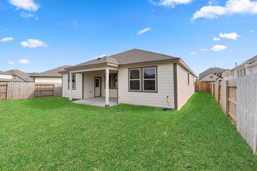 This backyard is perfect for family gatherings, social events, or simply unwinding in the fresh air.