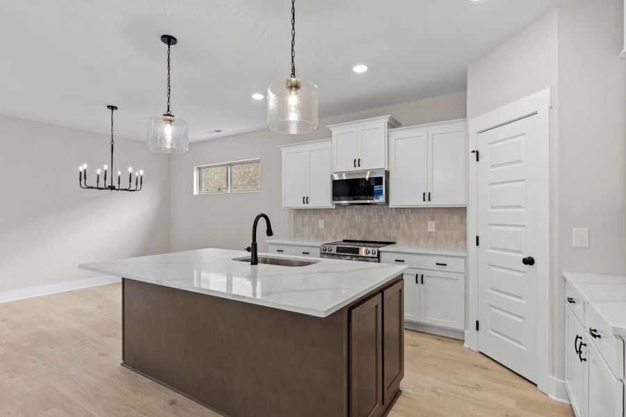 Furnished interior view inside a new home in The Paddock Courtyard, Bungalow, & Villa Homes, Gallatin (Image 4).
