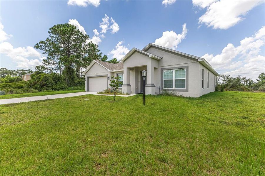 Front exterior of a new home in , Sebring, FL, highlighting curb appeal (Image 25).
