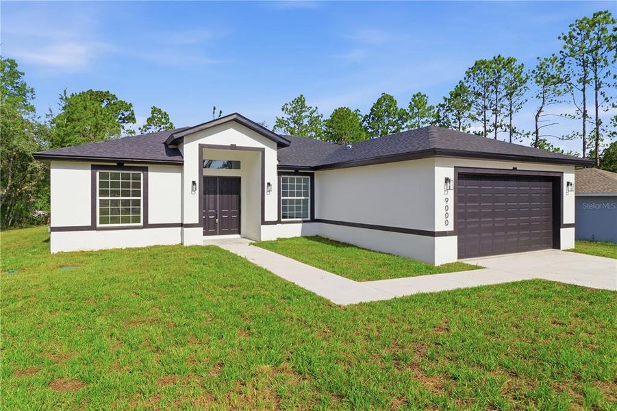 Front exterior of a new home in , Citrus Springs, FL, highlighting curb appeal (Image 1). Front exterior of a new home in , Citrus Springs, FL, highlighting curb appeal (Image 1).