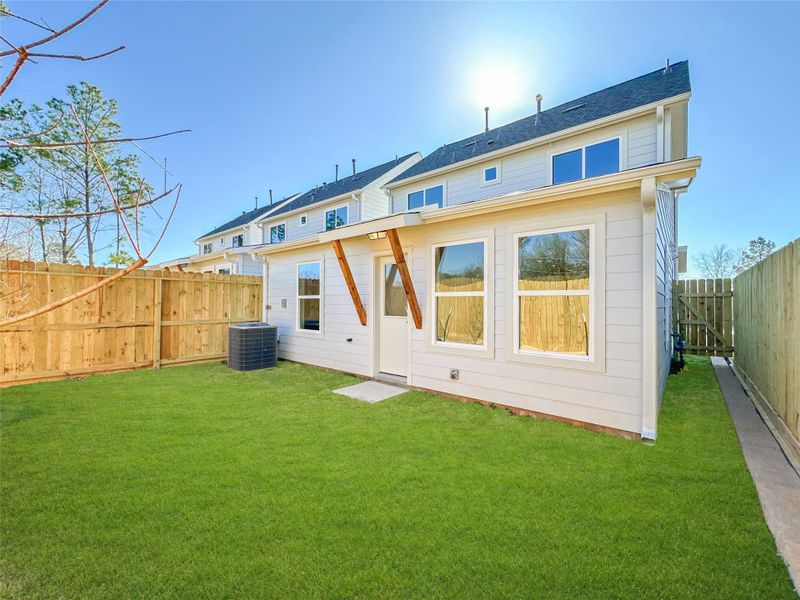 Exterior details and patio area of a home in , Conroe (Image 27).