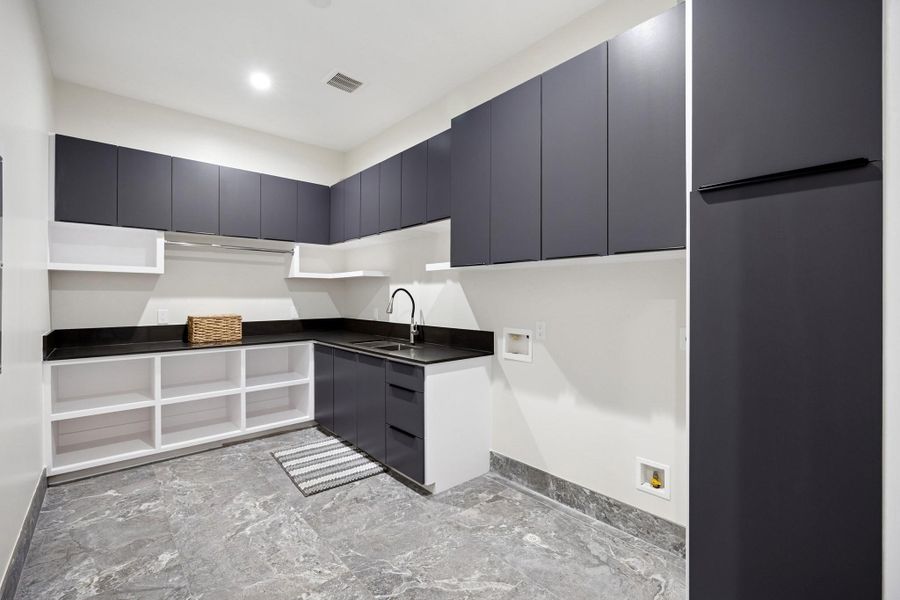 Spacious laundry area conveniently located on the second floor