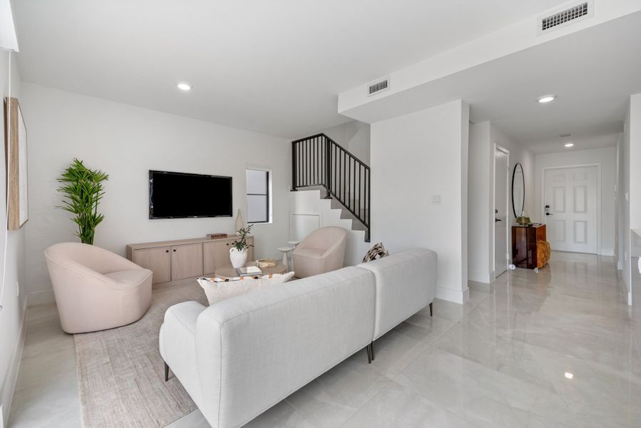 Representative furnished interior of a home built from the Model E by Onx Homes in On Alba, Florida City (Image 32).