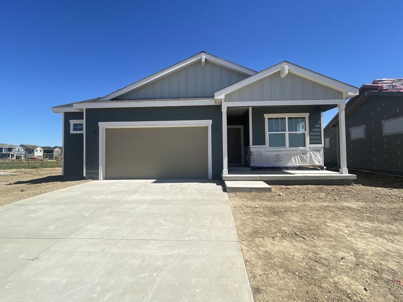 Front exterior of a new home in Granary, Johnstown, CO, highlighting curb appeal (Image 2). Front exterior of a new home in Granary, Johnstown, CO, highlighting curb appeal (Image 2).